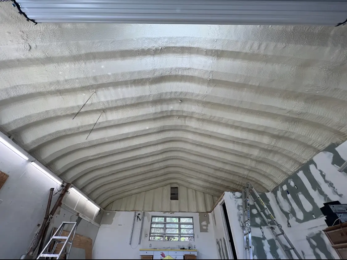 Spray polyurethane foam applied to the underside of a metal roof deck in Winchendon
